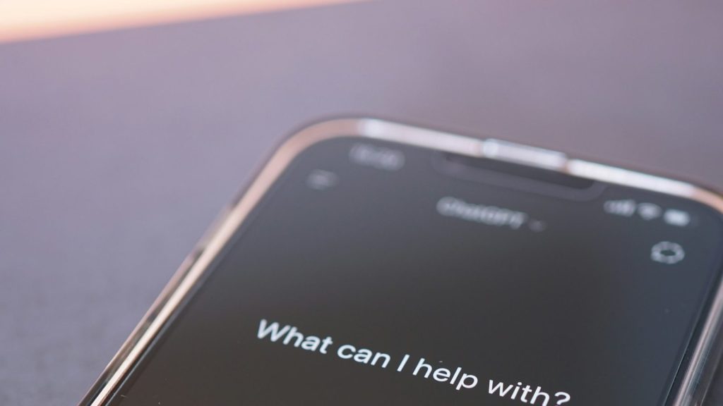 ChatGPT open on a phone asking "What can I help with?", one of the AI assistants donors now ask for recommendations